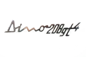 1975-79 Ferrari 208 GT4 OEM Rear Grille Badge Script Emblem